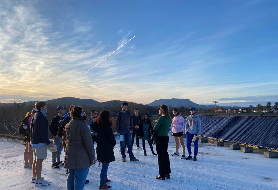 students with solar thermal array