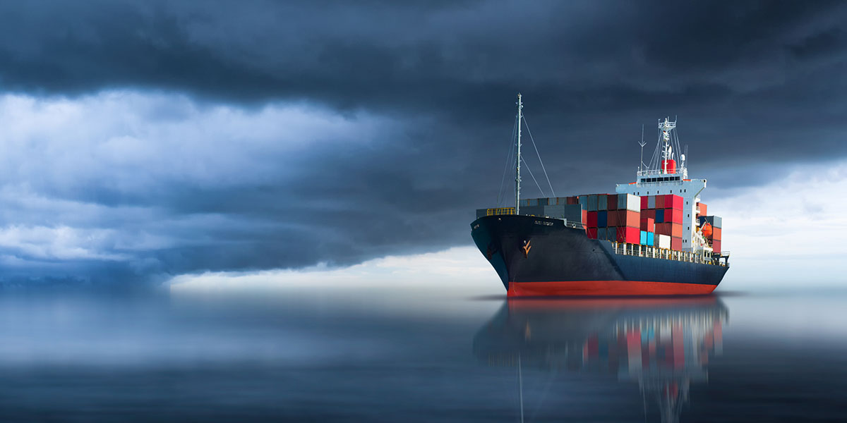 Container ship on cloudy day